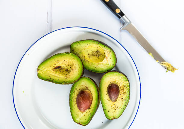 istock Overhead view of freshly prepared avocados 1127095236