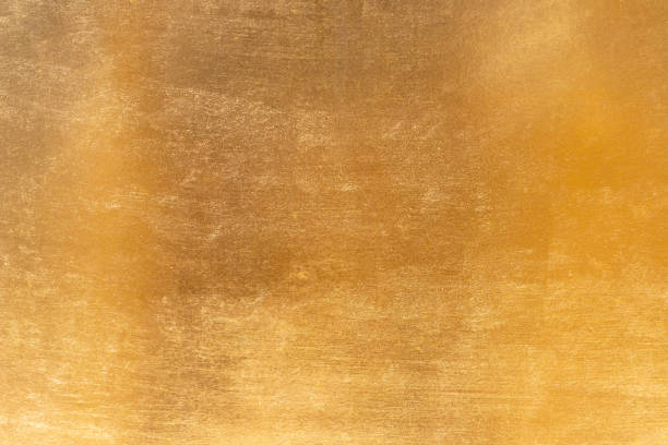 istock Shiny yellow leaf gold metall texture and background 1127095695