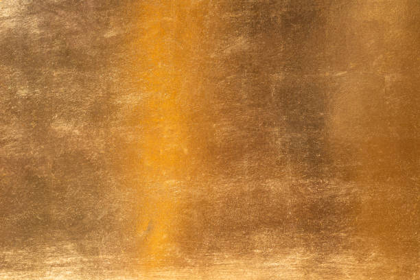 istock Shiny yellow leaf gold metall texture and background 1127097156