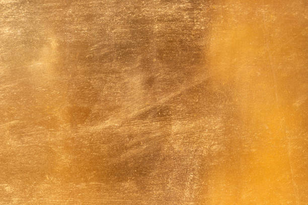 istock Shiny yellow leaf gold metall texture and background 1127097326