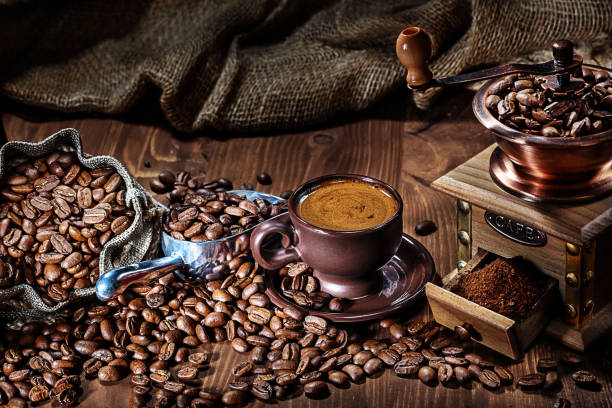 istock espresso in brown coffee cup mill scoop and sack with beans 1127097342