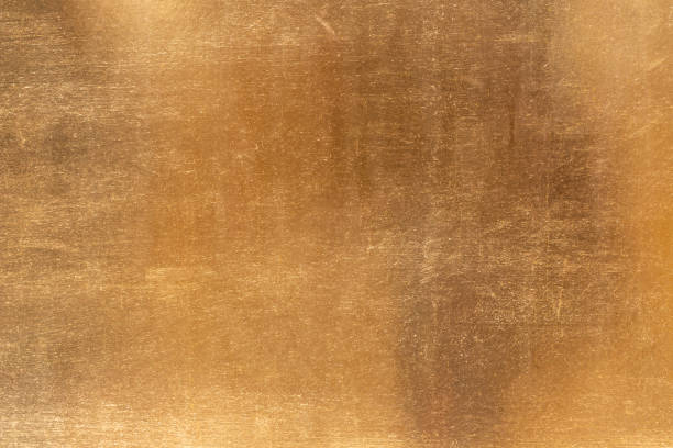 istock Shiny yellow leaf gold metall texture and background 1127097544