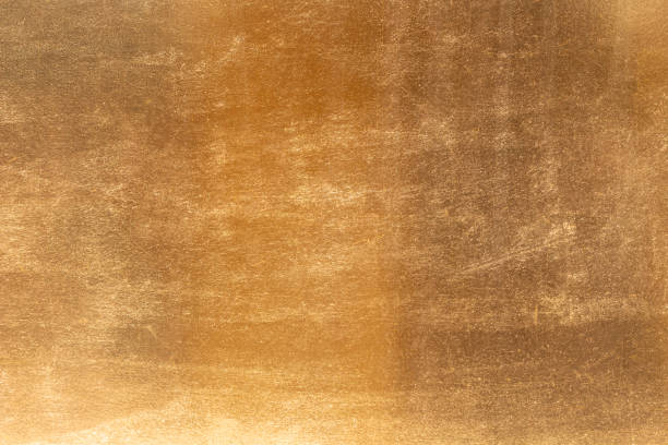 istock Shiny yellow leaf gold metall texture and background 1127098342
