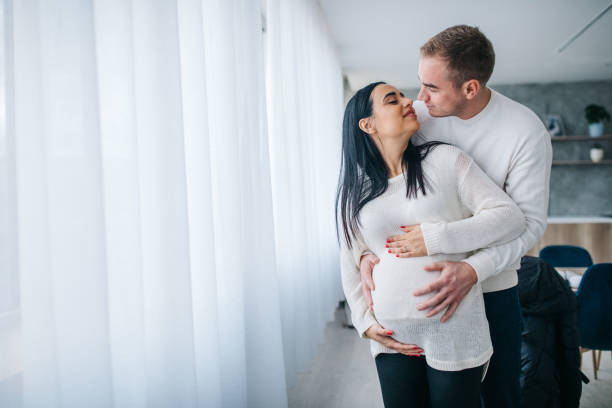 istock Parents touching pregnant belly 1127100908