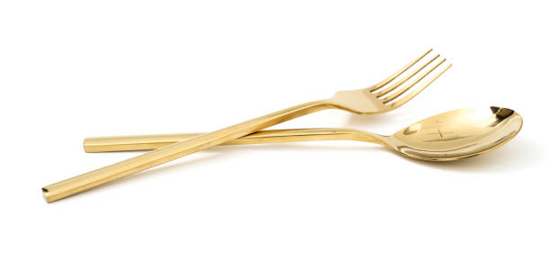 istock golden spoon and fork isolated on a white background 1127102666