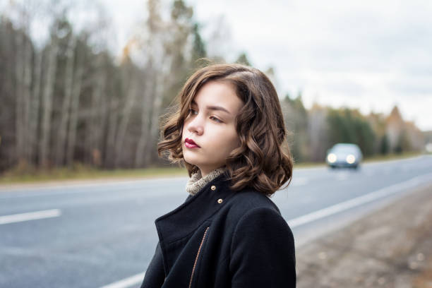 young beautiful girl in autumn forest