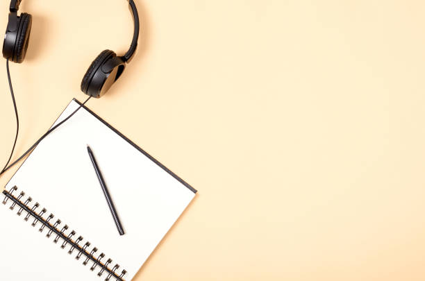 istock Home office workspace for blogging with notebook and headphones. 1127104768