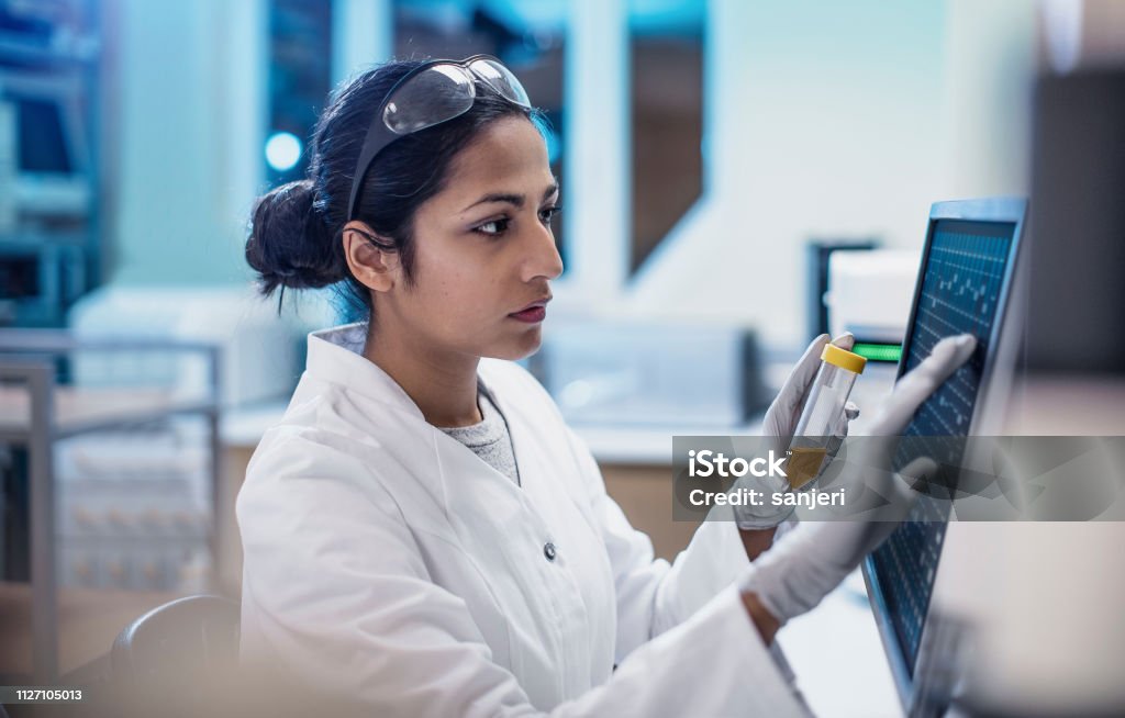 Female Scientist Working in The Lab, Using Computer Screen Laboratory Stock Photo