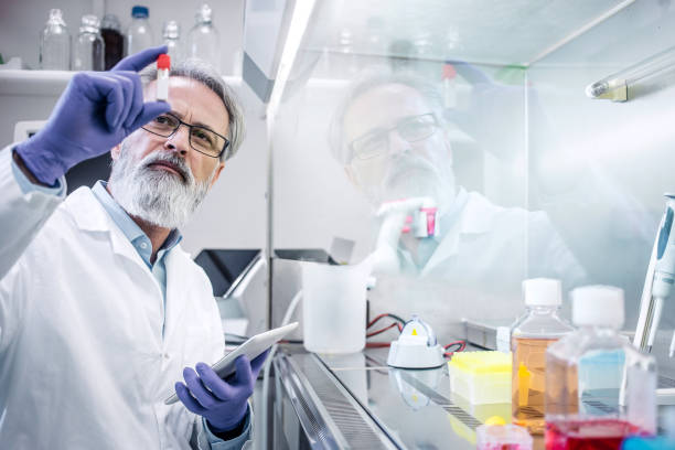 male scientist working in the digestorium - laboratory pharmacy medicine research imagens e fotografias de stock