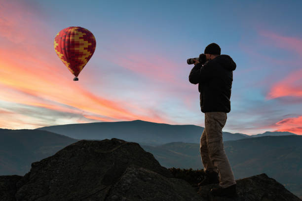 istock Photographer in mountains 1127107994