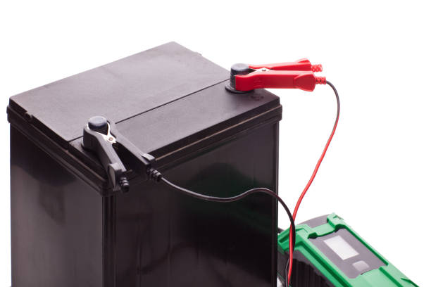 istock Car accumulator battery and charger. 1127111628