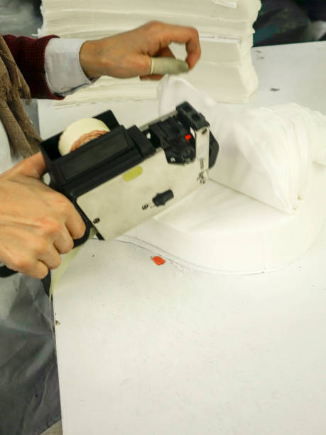 istock textile worker who is ranking the fabric number 1127111639