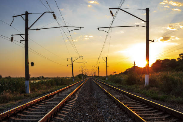 Summer landscape. Railway. Sunset. Perspective. Background image. Summer landscape. Railway. Sunset. Perspective. Background image. железнодорожная перевозка stock pictures, royalty-free photos & images