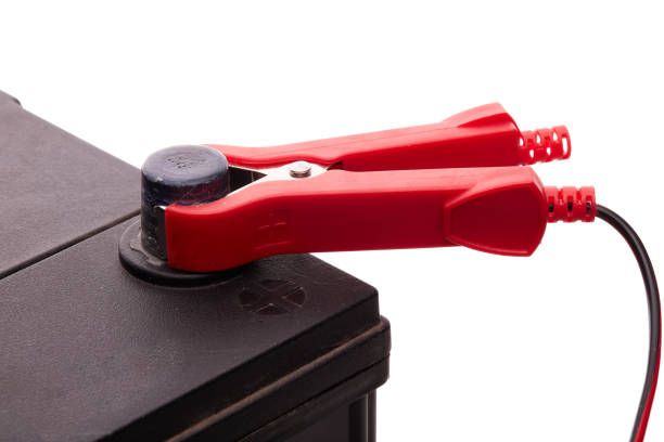 istock Car accumulator battery and charger. 1127111739