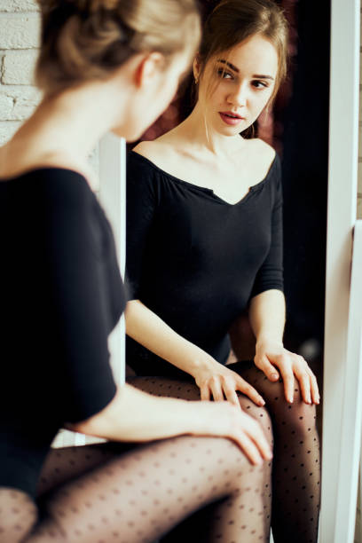 istock Model in beautiful underwear in front of the mirror 1127111888