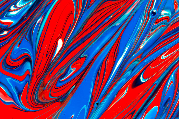 Abstract textured background of red, white and blue liquid paint mixing and swirling