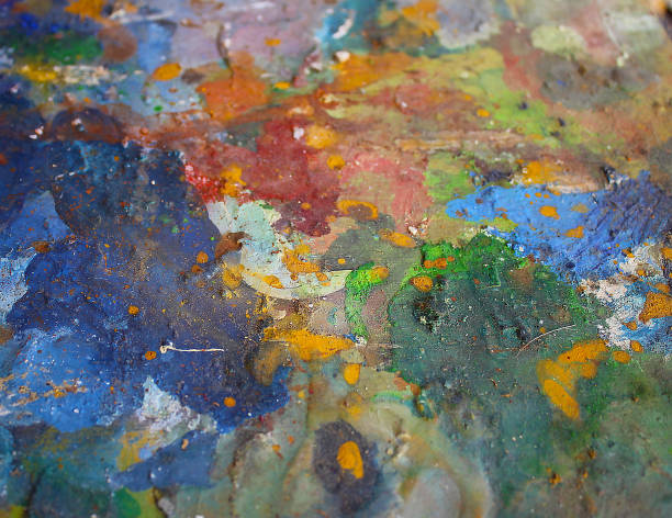 istock Old artistic pallet with many oil colors 1127113275