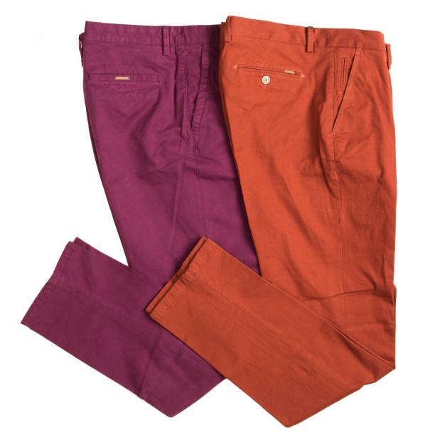 istock two colored pants laid out on a white background, fashion concept 1127113407