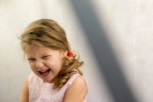 istock Little girl laughing 1127117277