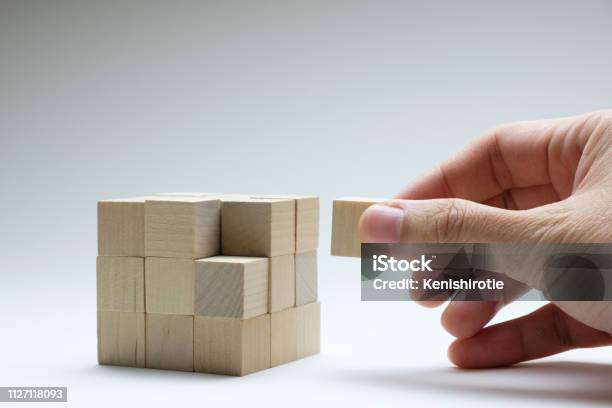 Last Missing Piece Wood Cube To Complete Stock Photo - Download Image Now - Puzzle Cube, Hand, Toy Block