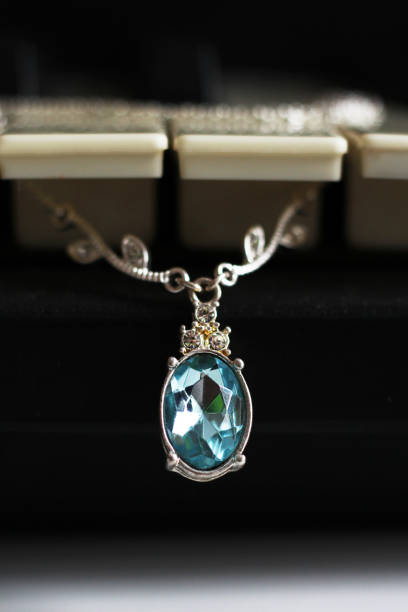 istock Necklace with a beautiful stone on the piano 1127123436
