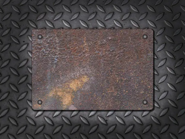Old metal plate sign with rivets on steel background. With copy space for your own text.