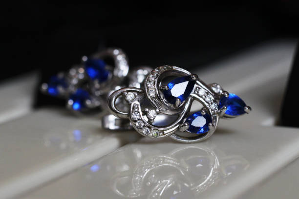 istock Large round earrings with stones on piano 1127124623