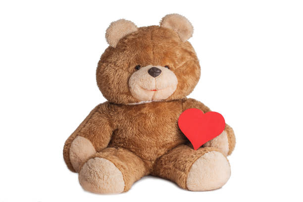 istock Big teddybear with red valentine heart isolated on white background 1127129650