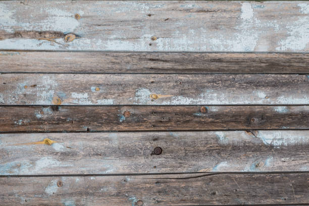 istock Old wooden planks with cracked blue paint 1127130834