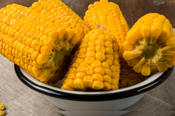 istock Cooked corn on a plate over old wooden table 1127130931