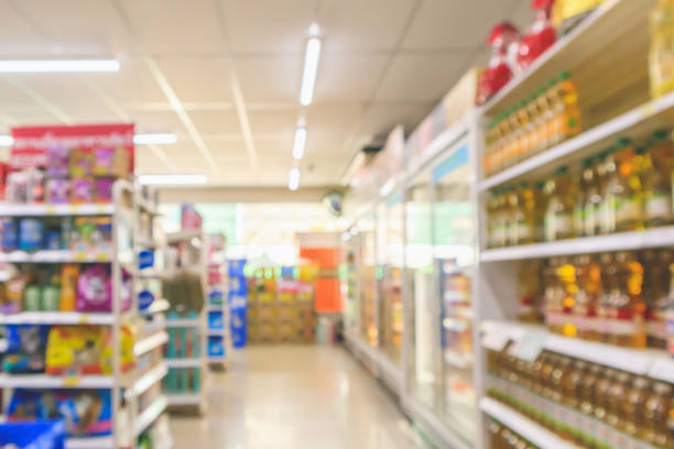 istock Supermarket aisle interior shelves blur background 1127132413