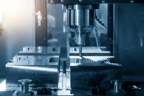 istock The CNC milling machine cutting the mould part . 1127133072
