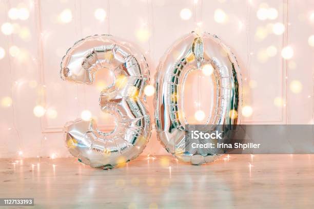 Silver Foil Birthday Balloons Number 30 With Glitter Lights Stock Photo - Download Image Now