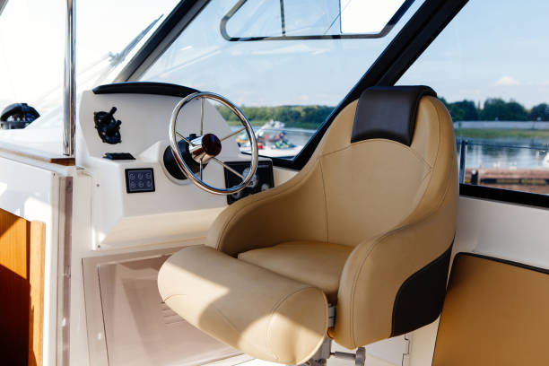 istock steering wheel on a luxury yacht cabin. 1127134664