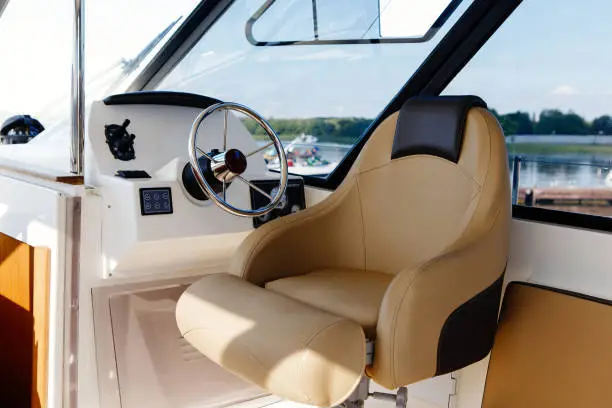 steering wheel on a luxury yacht cabin