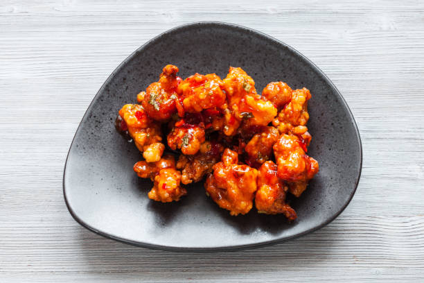 istock Kkanpunggi fried Chicken on plate on gray table 1127139736