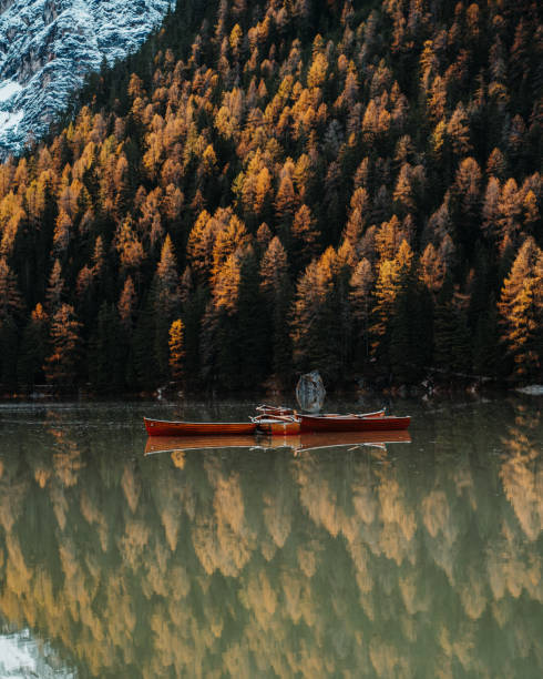 istock Autumn colours with boats on the lake 1127143220