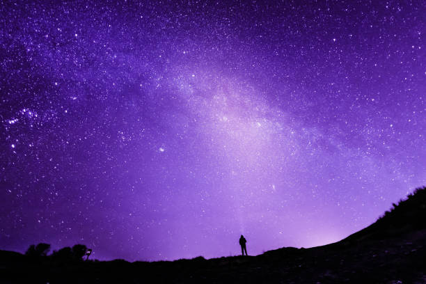 istock Senior Caucasian man starry sky background 1127143376