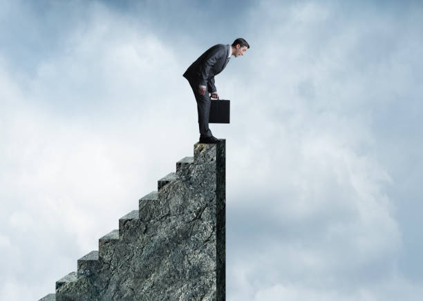 istock Businessman At The Precipice 1127143689