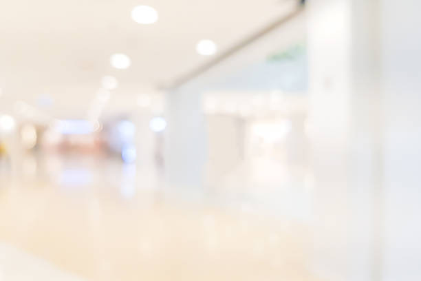 istock abstract blur inside modern architecture loft cozy interior shopping mall or department store with light bokeh fro design concept 1127146742