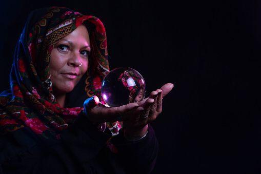 beautiful mature woman with crystal ball