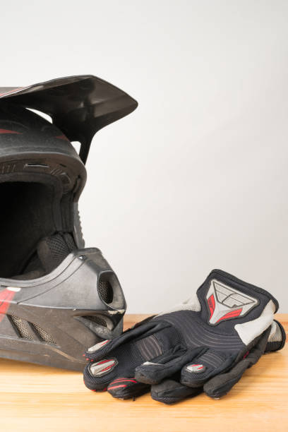 istock Motorcycle protective gear - motocross helmet and gloves. 1127148161