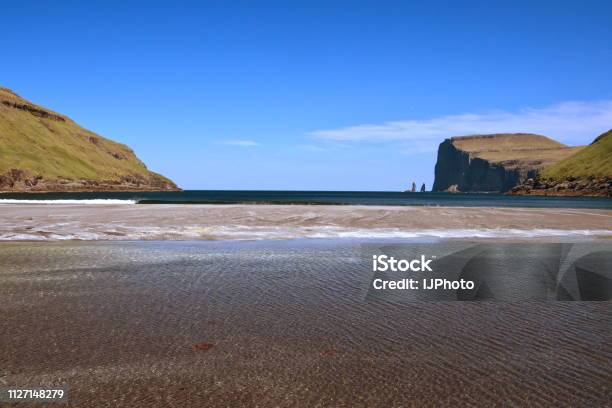 Spectacular View To Legendary Sea Stacks Risin Og Kellingin From Village Tjørnuvík Stock Photo - Download Image Now