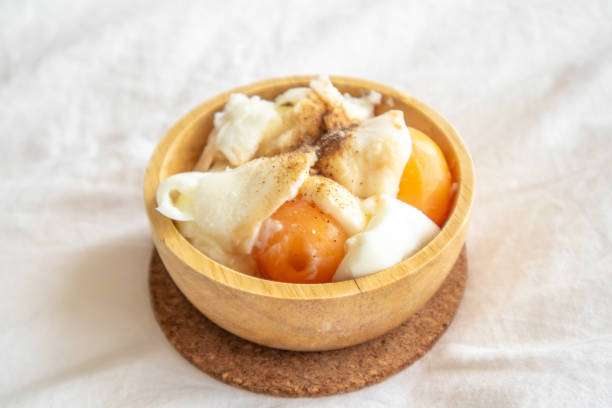istock Soft boiled eggs with pepper and salt in wooden cup. 1127151103