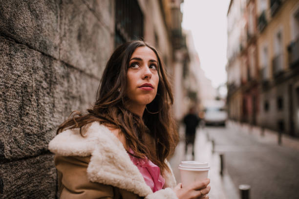 istock Young woman shopping with a coffee cup 1127151397