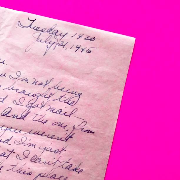 istock Old Love Letter 1945 on Hot Pink Background 1127151816