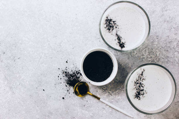 Black charcoal latte. Detox drink. Selective focus