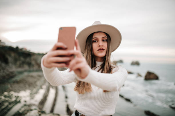 istock Young woman taking her selfie picture 1127152931
