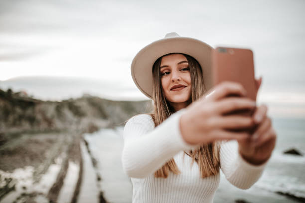 istock Young woman taking her selfie picture 1127152979