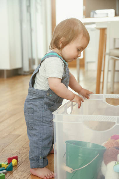 istock Little boy examining his box with toys 1127153408